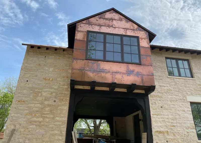 Copper metal panel facade on a stone building for Metal Roof Coating in Fort Oglethorpe
