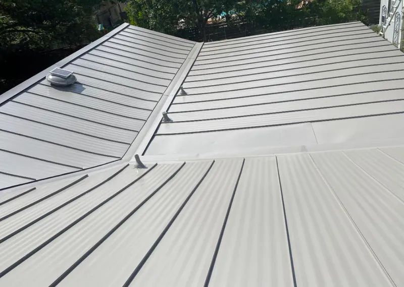 Solar attic fan installed on a metal roof for Roof Ventilation in Fort Oglethorpe
